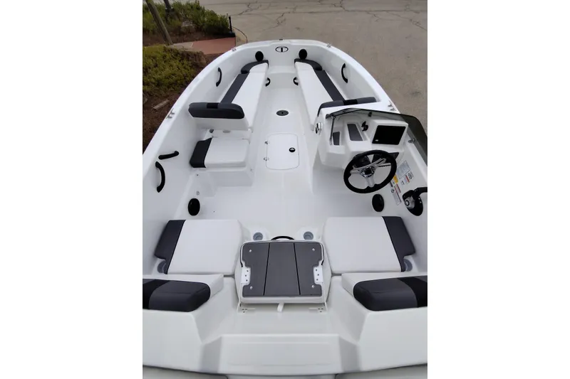 Slide: The Image of 2026 Tahoe T18 boat interior with seating and steering wheel, showcasing modern design. - 4