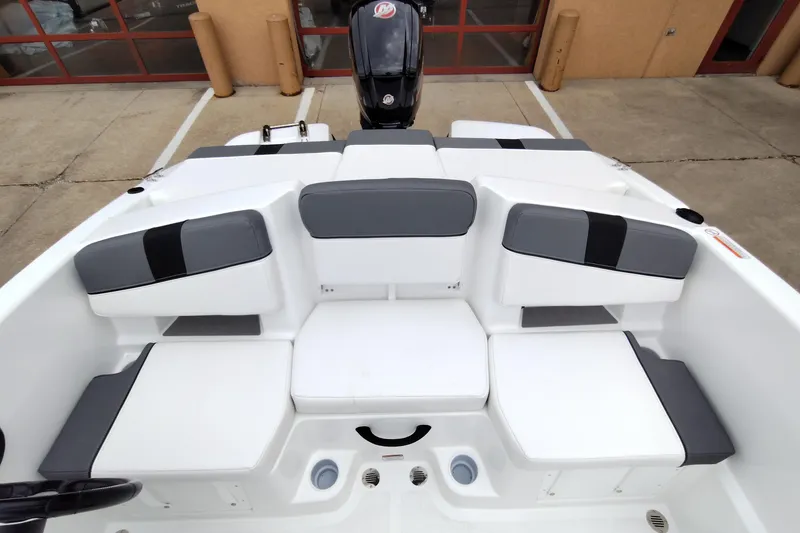 Slide: The Image of 2026 Tahoe T18 boat interior with gray and white seating arrangement. - 6