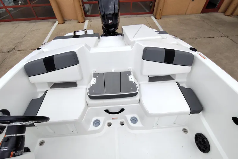 Slide: The Image of 2026 Tahoe T18 boat interior with white and gray seating, modern design. - 7