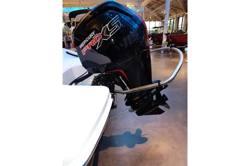 Slide: The Image of 2026 Tahoe T18 boat with Mercury Pro XS outboard motor in showroom. - 9
