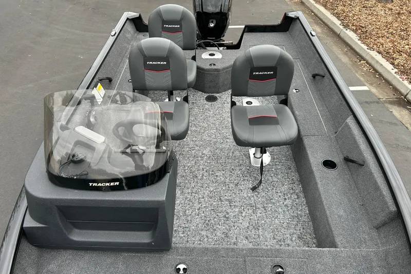 Slide: The Image of 2026 Tracker Pro Guide V-16 SC boat interior with seating and steering console. - 22