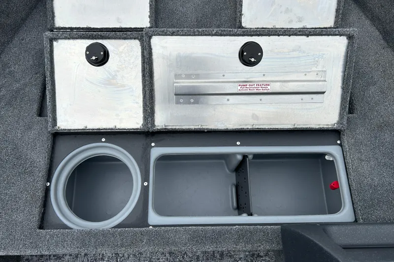 Slide: The Image of 2026 Tracker Pro Guide V-16 SC boat storage compartments and pump-out feature. - 20