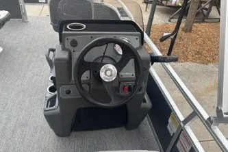 Slide: The Image of 2026 Sun Tracker Bass Buggy 16 XL Select steering console with modern controls and cup holders. - 14
