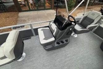 Slide: The Image of 2026 Sun Tracker Bass Buggy 16 XL Select pontoon boat interior with seating and console. - 13