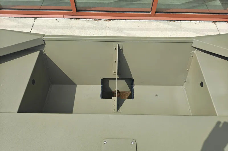 Slide: The Image of 2026 Tracker Grizzly 1754 Utility boat interior, showcasing storage compartments and durable construction. - 24