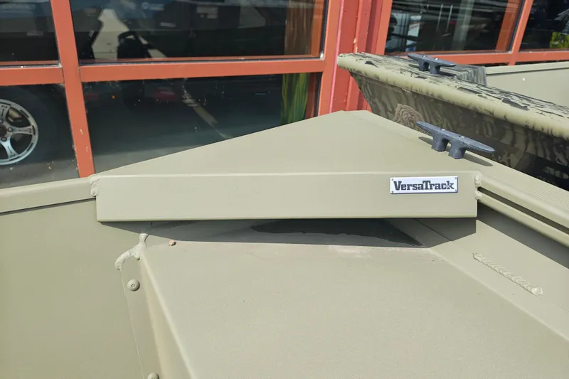 Slide: The Image of 2026 Tracker Grizzly 1754 Utility boat with VersaTrack system, outdoor display. - 25