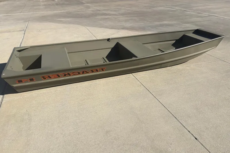 The Image of 2026 Tracker Grizzly 14 Jon boat on concrete surface, showcasing its sturdy design. - 0