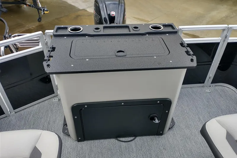 Slide: The Image of 2026 Sun Tracker Fishin' Barge 20 DLX fishing station with rod holders and storage. - 10