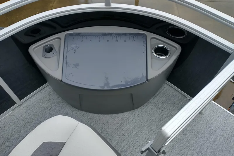 Slide: The Image of 2026 Sun Tracker Fishin' Barge 20 DLX fishing station with measuring board and cup holders. - 6