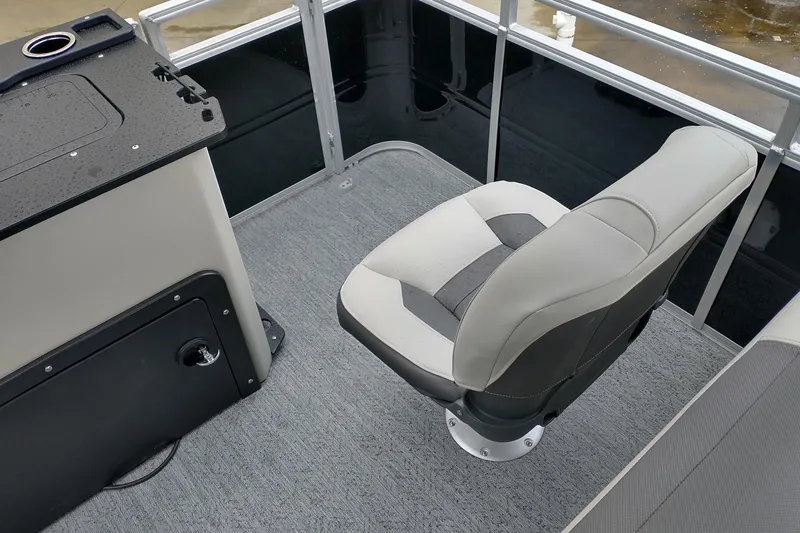 Slide: The Image of 2026 Sun Tracker Fishin' Barge 20 DLX interior with comfortable seating and sleek design. - 9
