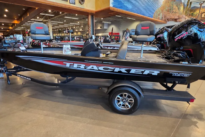 The Image of 2026 Tracker Pro Team 190 boat displayed indoors, featuring sleek design and comfortable seating. - 0