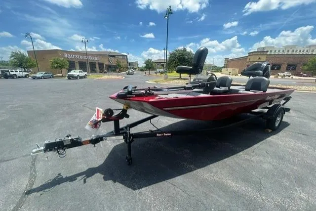 Slide: The Image of 2026 Tracker Bass Tracker Classic XL boat on trailer in parking lot. - 2