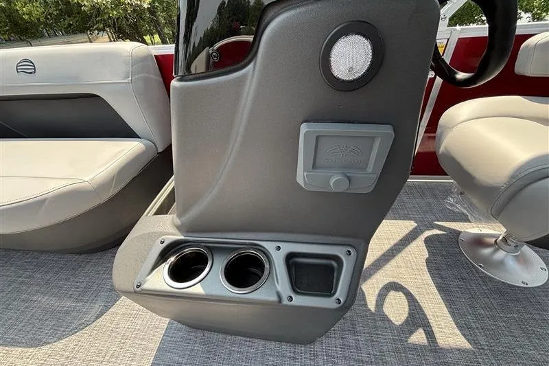 Slide: The Image of Interior of 2026 Sun Tracker Party Barge 16 DLX with cup holders and seating. - 15