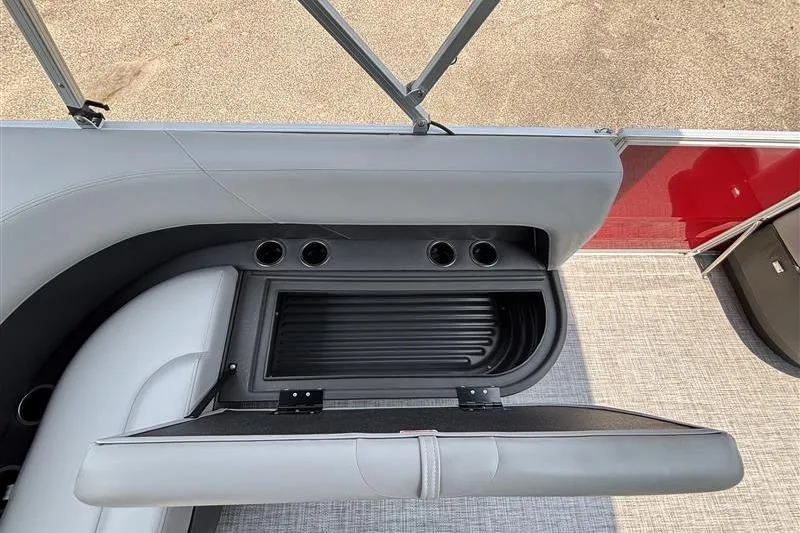 Slide: The Image of 2026 Sun Tracker Party Barge 16 DLX seating with storage compartment and cup holders. - 17