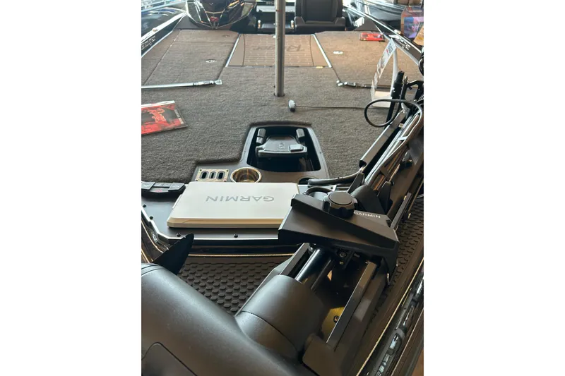 Slide: The Image of 2026 Ranger Z521R Cup-Equipped boat interior with Garmin equipment and carpeted deck. - 3