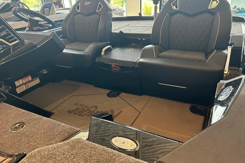 Slide: The Image of Interior of 2026 Ranger Z521R Cup-Equipped boat with luxurious seating and modern dashboard. - 4