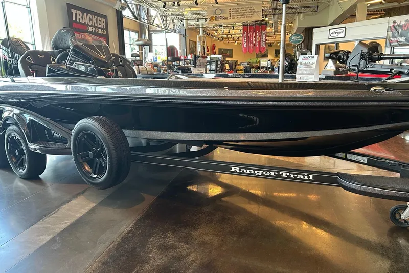 The Image of 2026 Ranger Z521R Cup-Equipped boat on display in showroom with Tracker signage. - 0