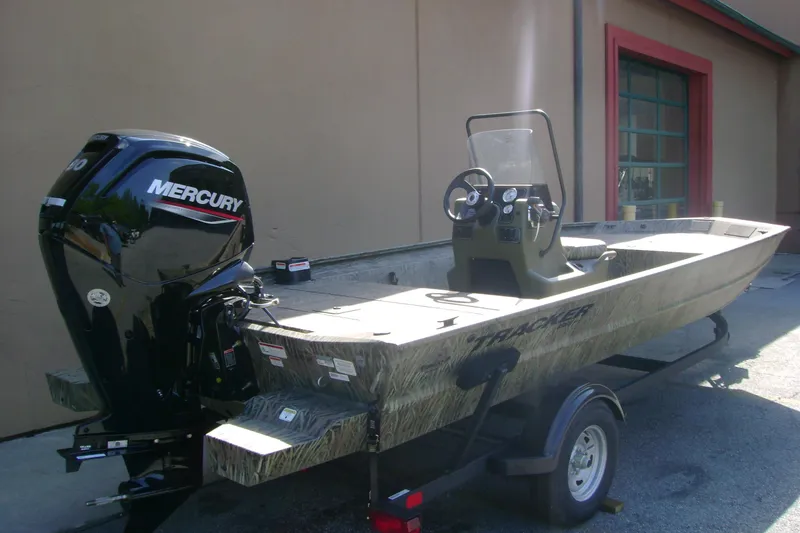 Slide: The Image of 2026 Tracker Grizzly 1860 CC boat with Mercury engine on trailer. - 2