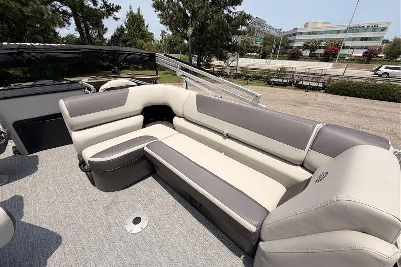 Slide: The Image of 2026 Sun Tracker Fishin' Barge 22 XP3 interior with spacious seating and modern design. - 13