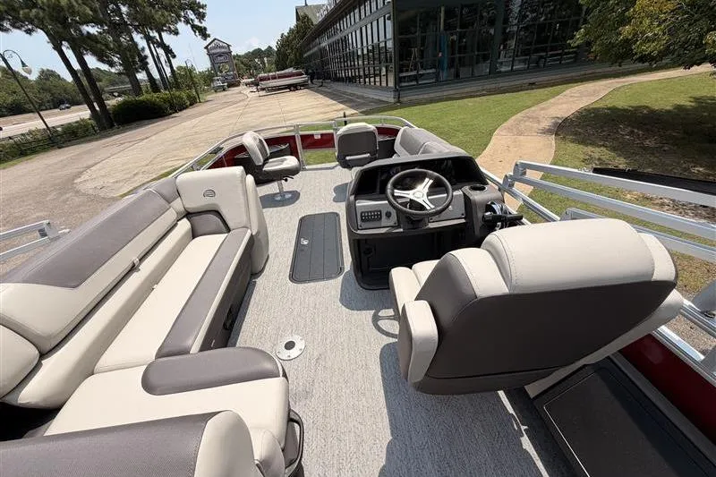 Slide: The Image of 2026 Sun Tracker Fishin' Barge 22 XP3 interior with seating and steering console. - 17