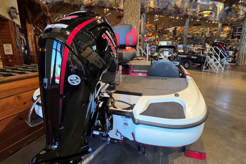 Slide: The Image of 2026 Nitro Z17 boat with powerful engine displayed in a showroom setting. - 1