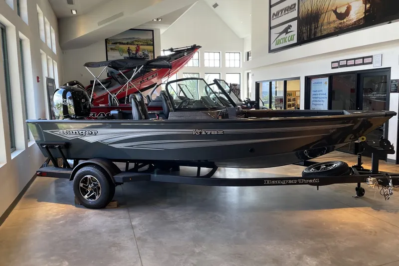 Slide: The Image of 2026 Ranger VS1782SC Angler boat displayed indoors on a trailer. - 1