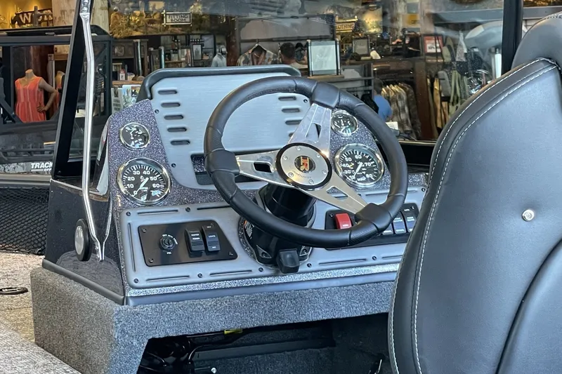 Slide: The Image of 2026 Ranger VS1782SC Angler boat dashboard with steering wheel and gauges. - 4