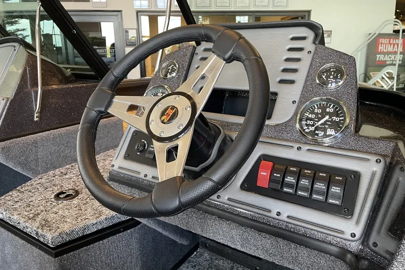 Slide: The Image of Steering console of 2026 Ranger VS1782SC Angler boat with gauges and control panel. - 2