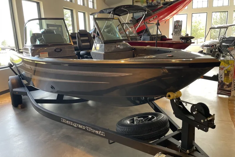 Slide: The Image of 2026 Ranger VS1782SC Angler boat displayed indoors on a trailer. - 5
