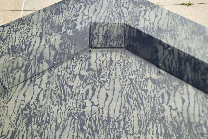 Slide: The Image of Camouflage pattern on 2026 Tracker Grizzly 1648 Utility boat surface. - 11