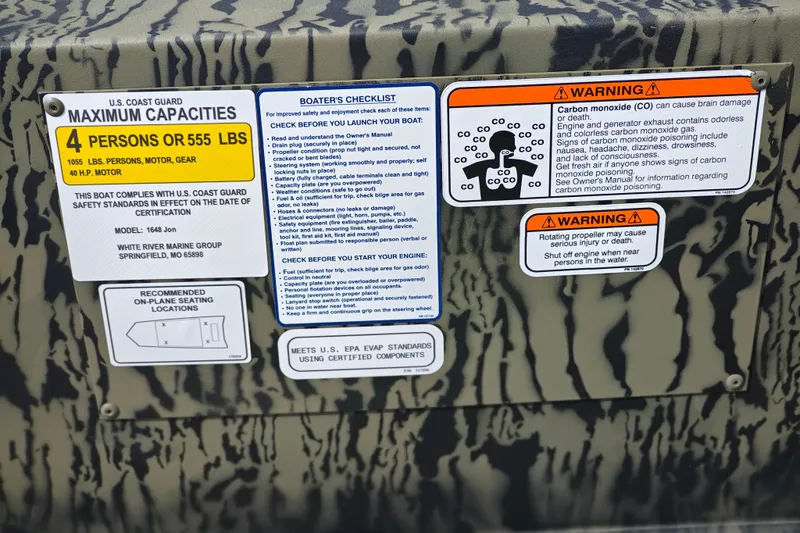 Slide: The Image of Safety and capacity labels on 2026 Tracker Grizzly 1648 Utility boat. - 7