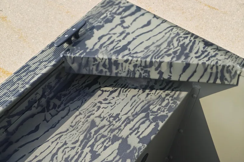 Slide: The Image of 2026 Tracker Grizzly 1648 Utility boat with camouflage pattern detail. - 13