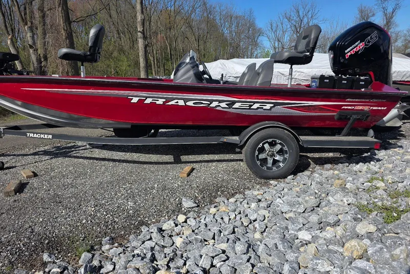 The Image of 2019 Tracker Pro Team 190 TX Tournament Edition boat on trailer, parked outdoors. - 0
