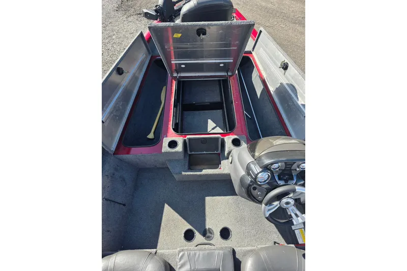 Slide: The Image of 2019 Tracker Pro Team 190 TX Tournament Edition boat interior with open storage compartments. - 10