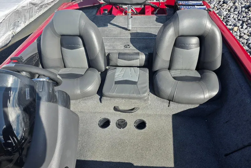 Slide: The Image of 2019 Tracker Pro Team 190 TX Tournament Edition boat interior with gray seating and steering wheel. - 15