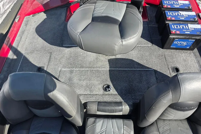 Slide: The Image of 2019 Tracker Pro Team 190 TX boat interior with seats and Ionic deep cycle batteries. - 18