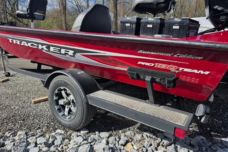 Slide: The Image of 2019 Tracker Pro Team 190 TX Tournament Edition boat on trailer, red exterior. - 3