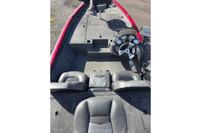 Slide: The Image of 2019 Tracker Pro Team 190 TX Tournament Edition boat interior with steering console and seating. - 8
