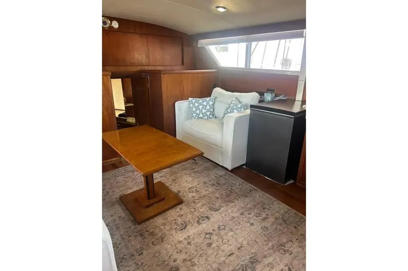 Slide: The Image of Interior of 1978 Chris-Craft 45 Commander with cozy seating and wooden table. - 22