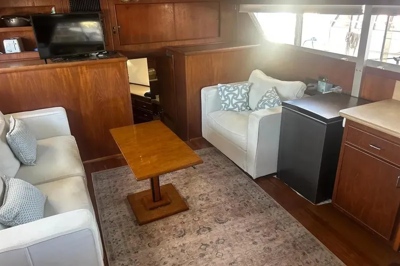 Slide: The Image of Interior of 1978 Chris-Craft 45 Commander yacht with cozy seating and wooden accents. - 23