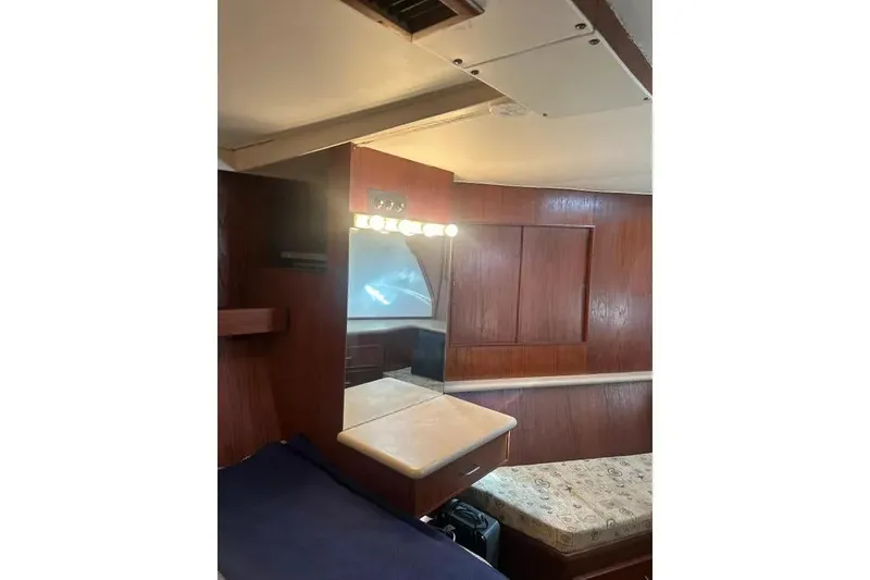 Slide: The Image of 1978 Chris-Craft 45 Commander interior with wood paneling and vanity mirror. - 29