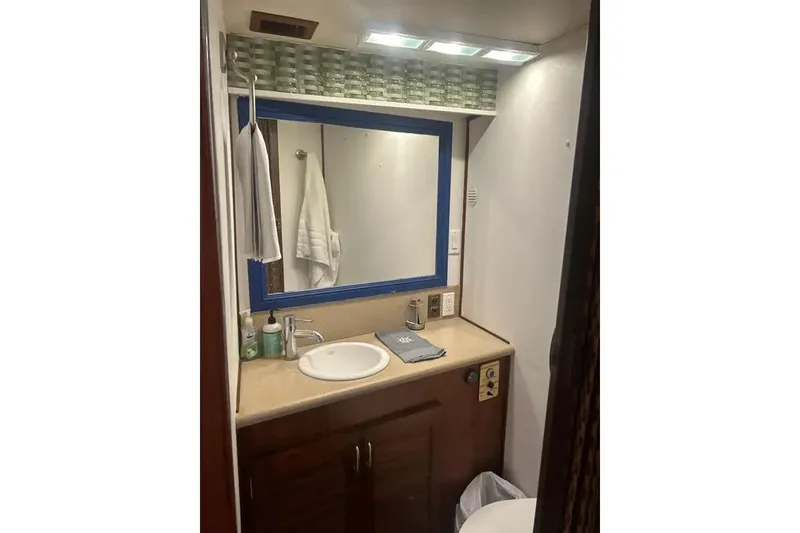 Slide: The Image of Bathroom interior of 1978 Chris-Craft 45 Commander yacht with sink and mirror. - 30
