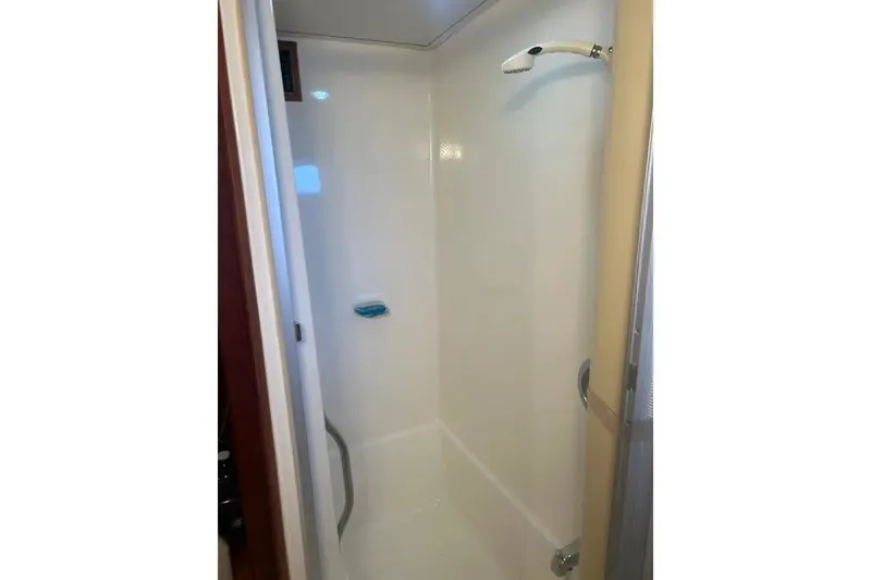 Slide: The Image of Shower area inside 1978 Chris-Craft 45 Commander yacht, featuring a sleek, compact design. - 33