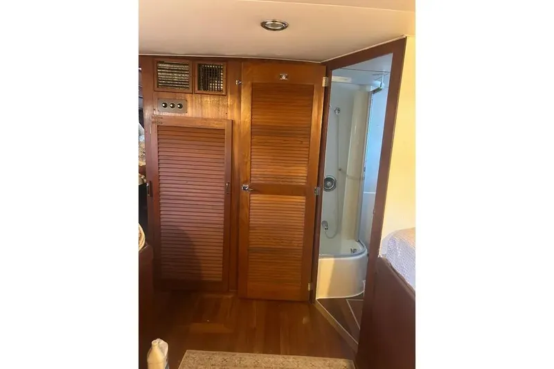 Slide: The Image of 1978 Chris-Craft 45 Commander interior with wooden cabinetry and shower area. - 38