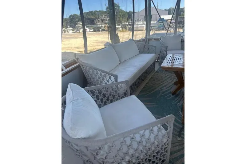 Slide: The Image of Interior of 1978 Chris-Craft 45 Commander with elegant white seating and wooden table. - 40