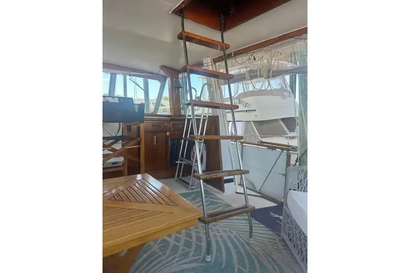 Slide: The Image of Interior of 1978 Chris-Craft 45 Commander yacht with wooden ladder and nautical decor. - 44