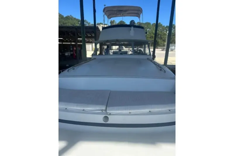 Slide: The Image of 1978 Chris-Craft 45 Commander yacht docked in a marina, showcasing its sleek design. - 5