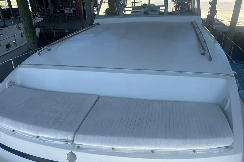 Slide: The Image of 1978 Chris-Craft 45 Commander yacht with spacious deck and cushioned seating. - 7