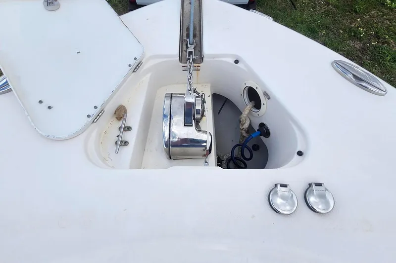 Slide: The Image of 2015 Robalo R300 Center Console anchor compartment with chain and rope. - 30
