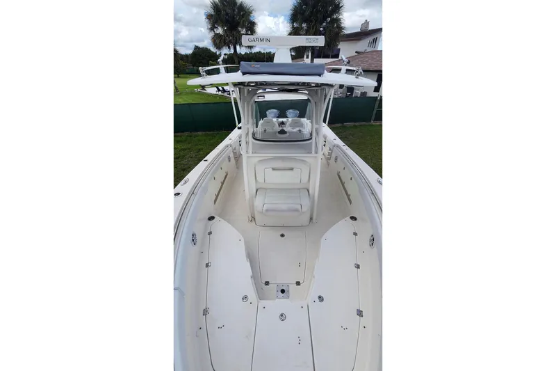 Slide: The Image of 2015 Robalo R300 Center Console boat with spacious deck and modern console. - 32
